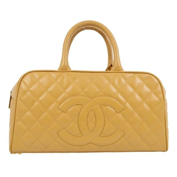 CHANEL Handbags - Chanel Beige Caviar Bowling Bag